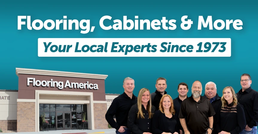 Dog chewing on tennis ball on white tile by Flooring America