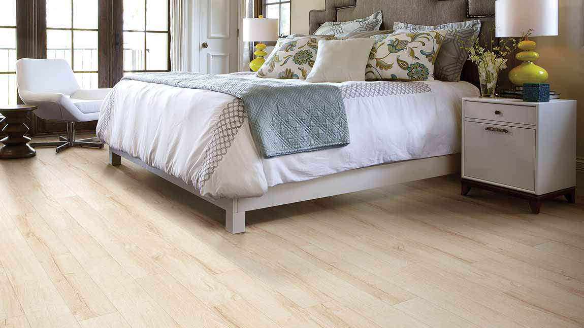 Laminate flooring in a bedroom, installation services available.